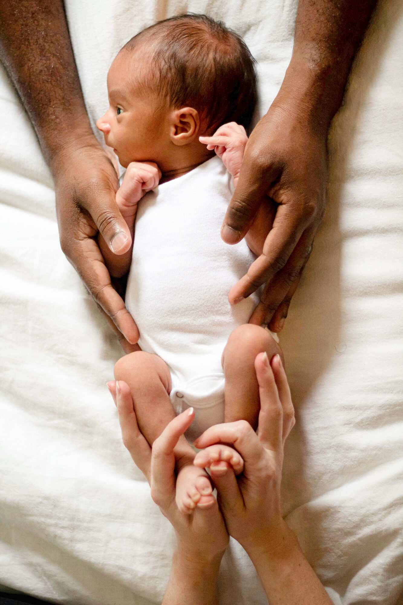 Newborn held in hands